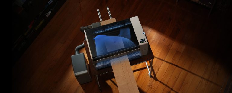 Bambu Lab R1 working on a long board that passes through the machine
