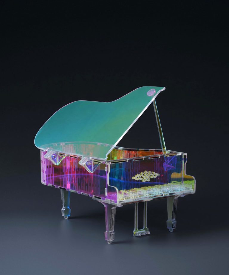 Laser cut acrylic piano model, a sample project Bambu Lab shows for the R1